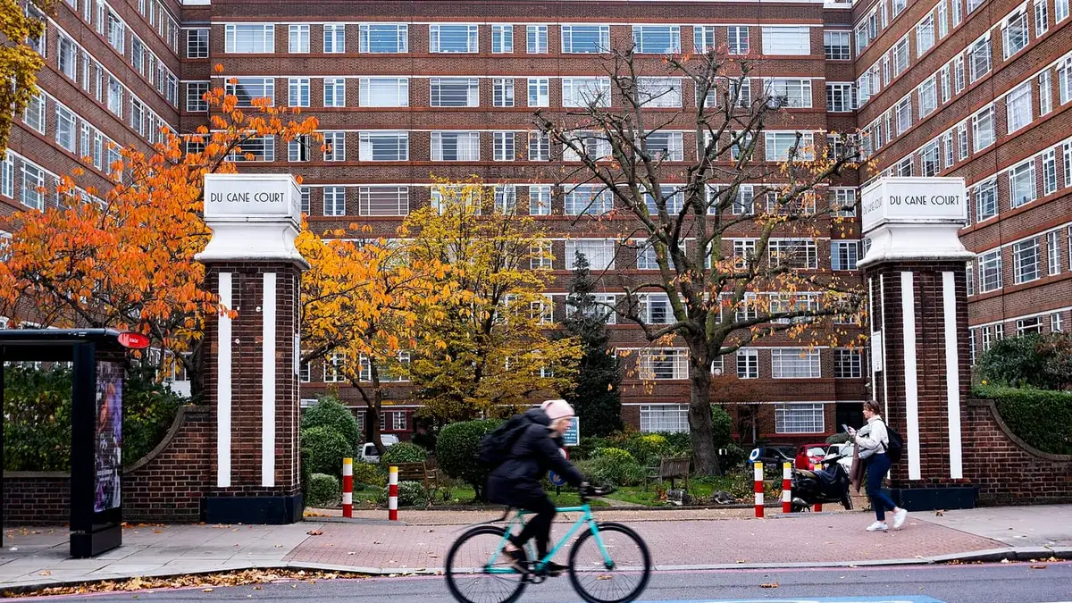 The gates and Art Deco block of Du Cane Court on Balham High Road