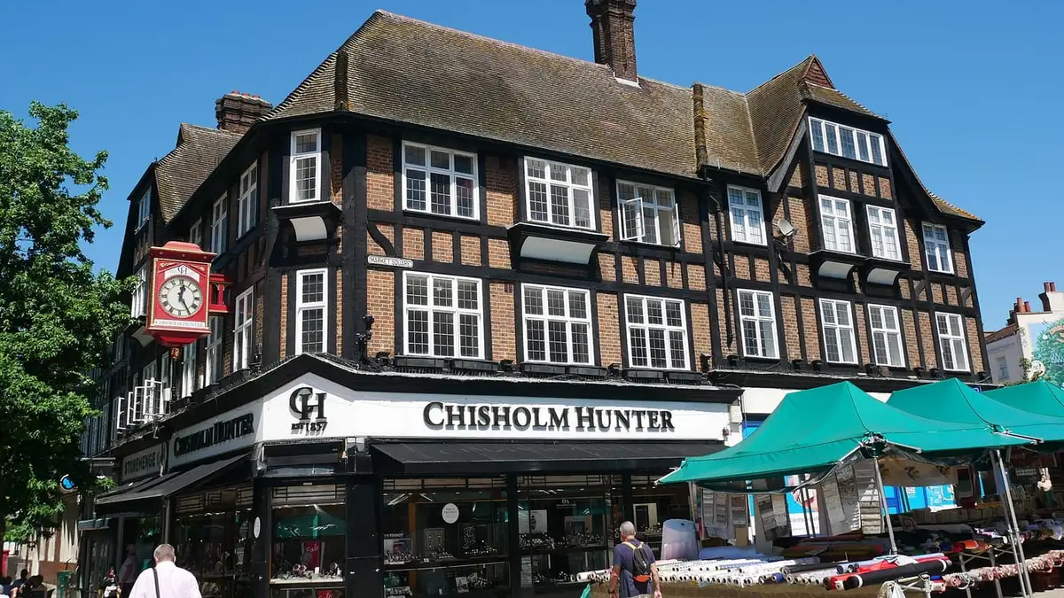 Mock-Tudor corner building and market stalls on Bromley High Street / Market Square