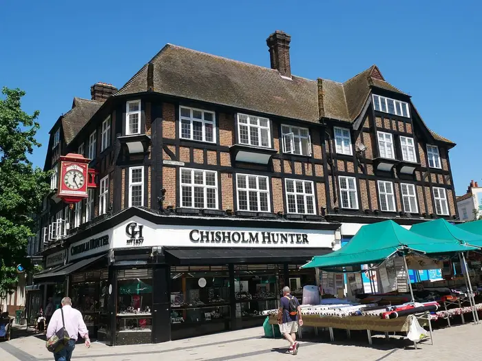 Mock-Tudor corner building and market stalls on Bromley High Street / Market Square
