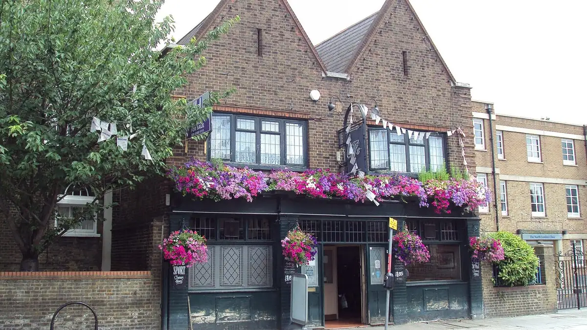 A pub hung with flower baskets on Church Street, Edmonton