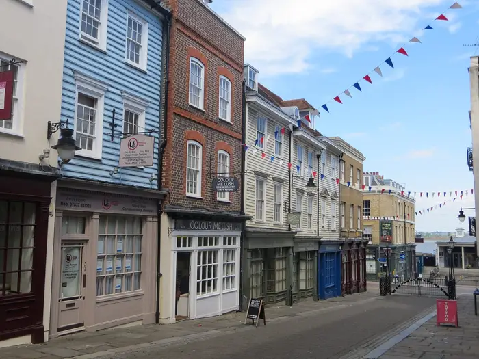 Historic weatherboarded and brick shopfronts on Gravesend High Street, Kent