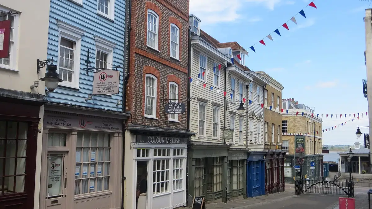 Historic weatherboarded and brick shopfronts on Gravesend High Street, Kent
