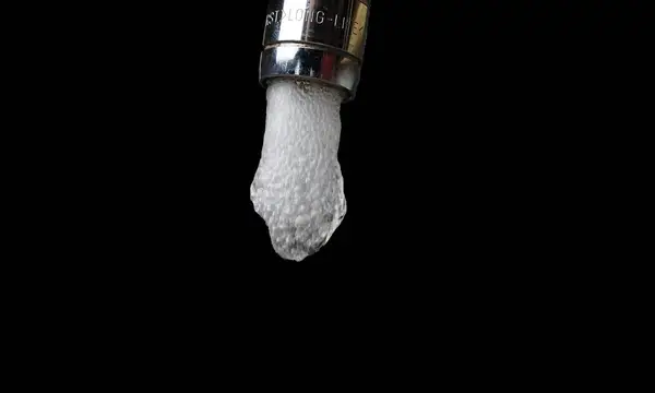 Water spluttering from a tap as it starts to flow