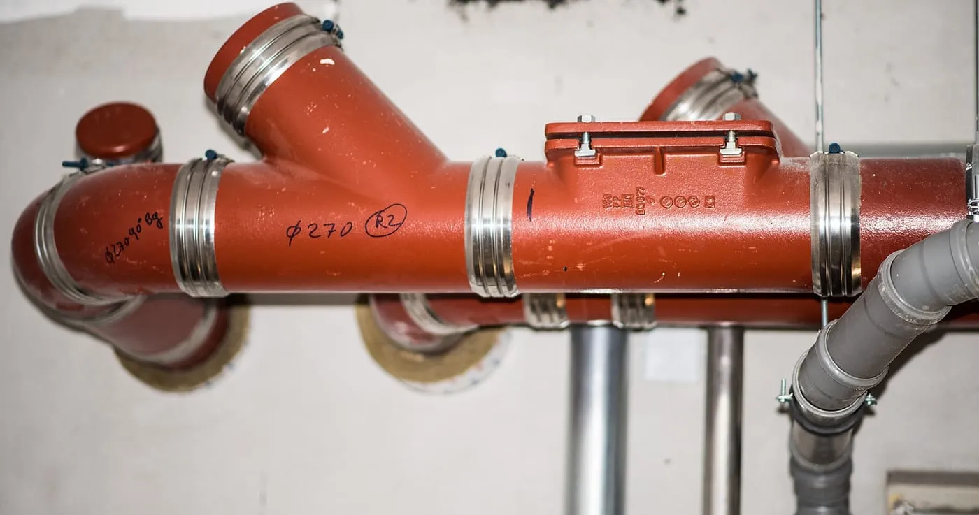 Drainage pipes and fittings in a basement