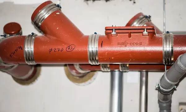 Drainage pipes and fittings in a basement