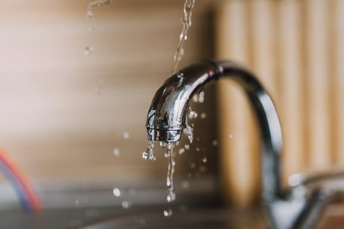 Water running from a chrome kitchen tap