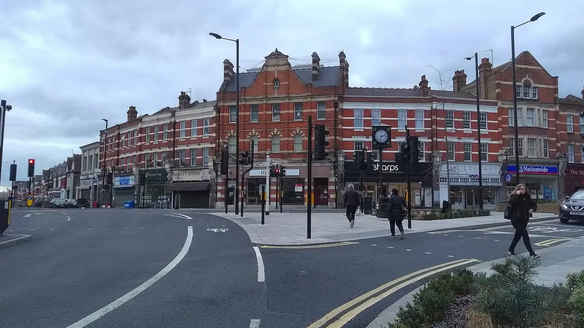 The Triangle, Palmers Green, with its clock and Victorian buildings on Green Lanes