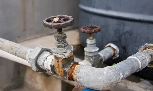 Old wheel-handled stop valves on pipework