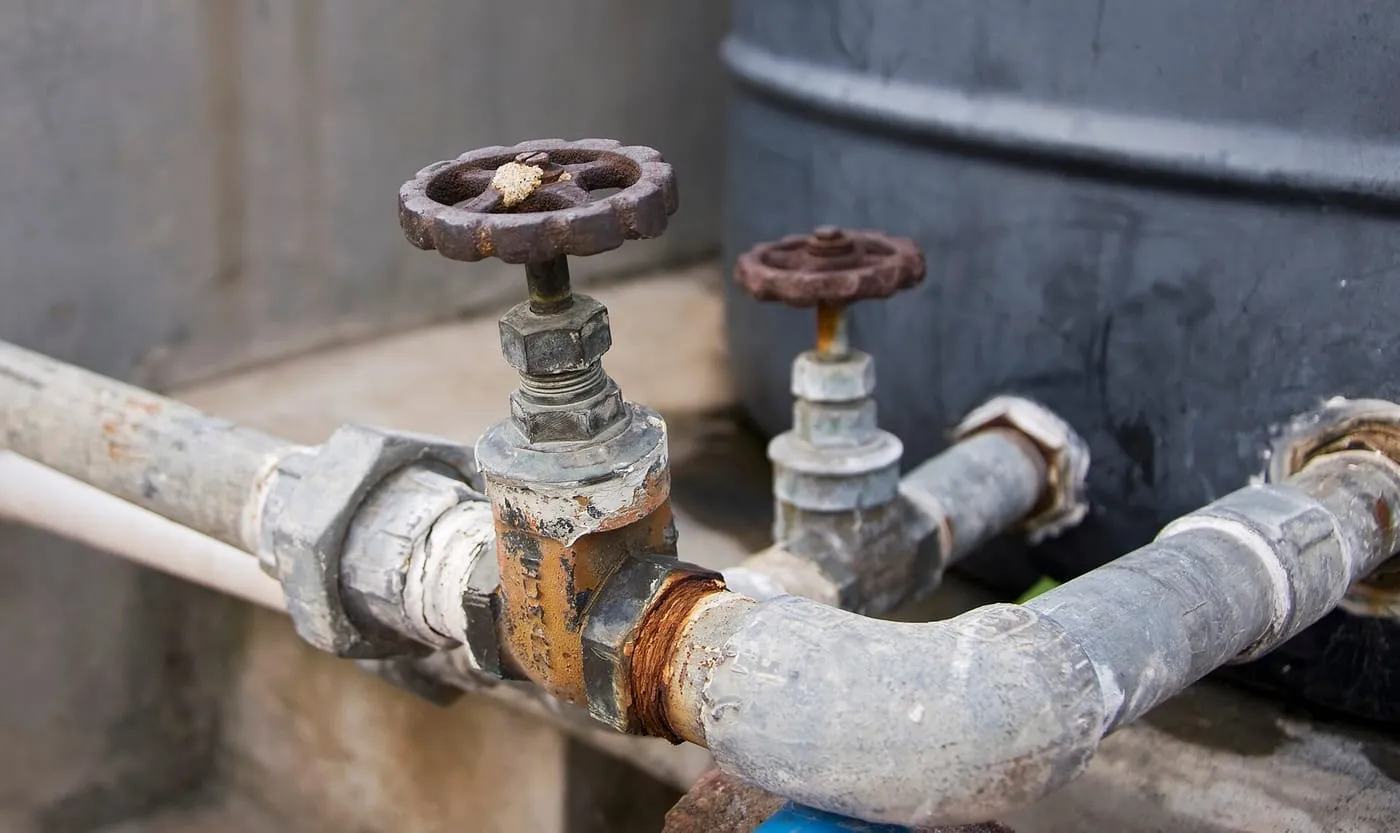 Old wheel-handled stop valves on pipework